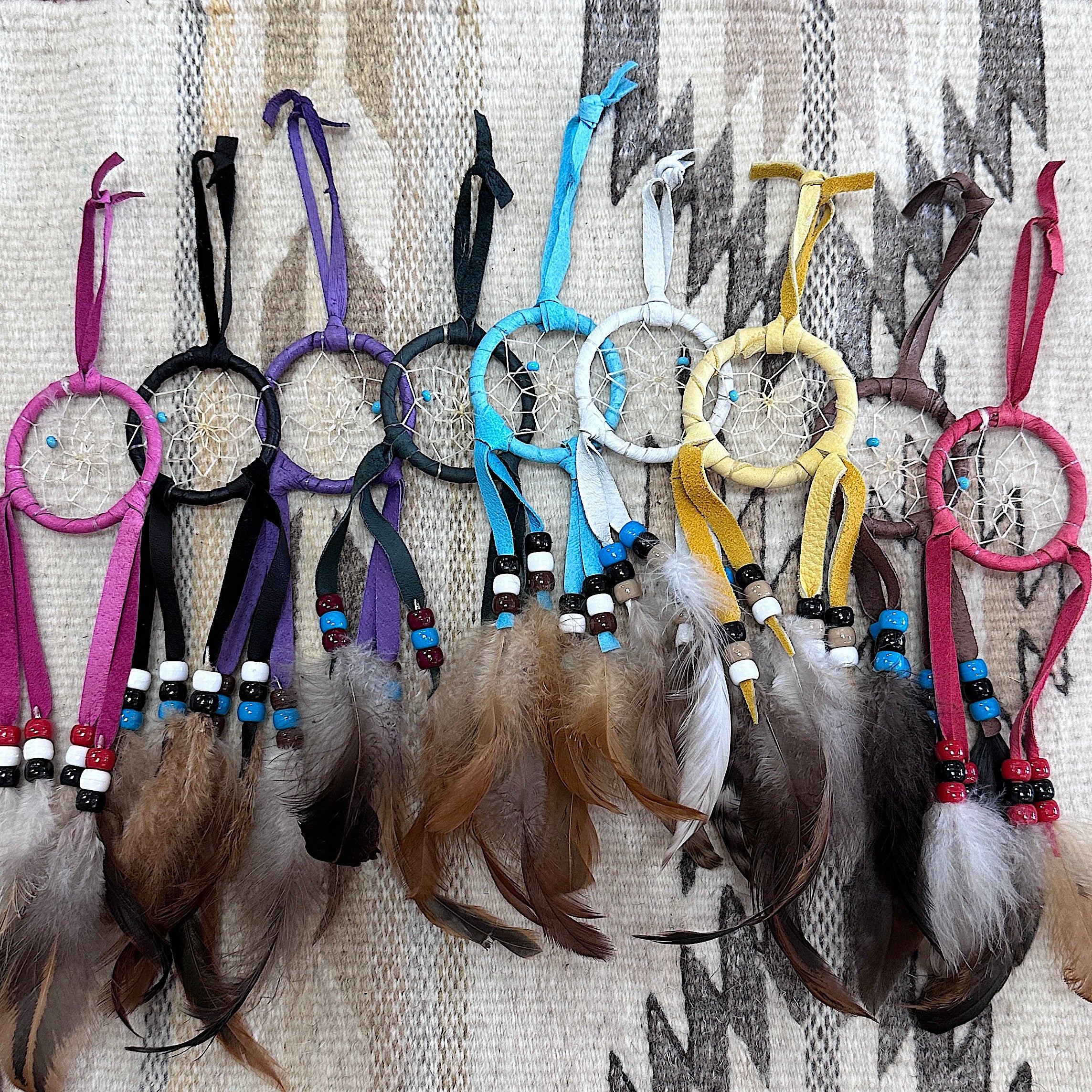 Shot of multiple dreamcatchers of various colors placed together