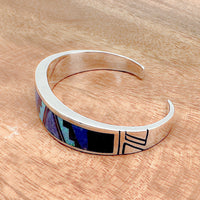 Shot of a blue sky inlay cuff bracelet as viewed from the side