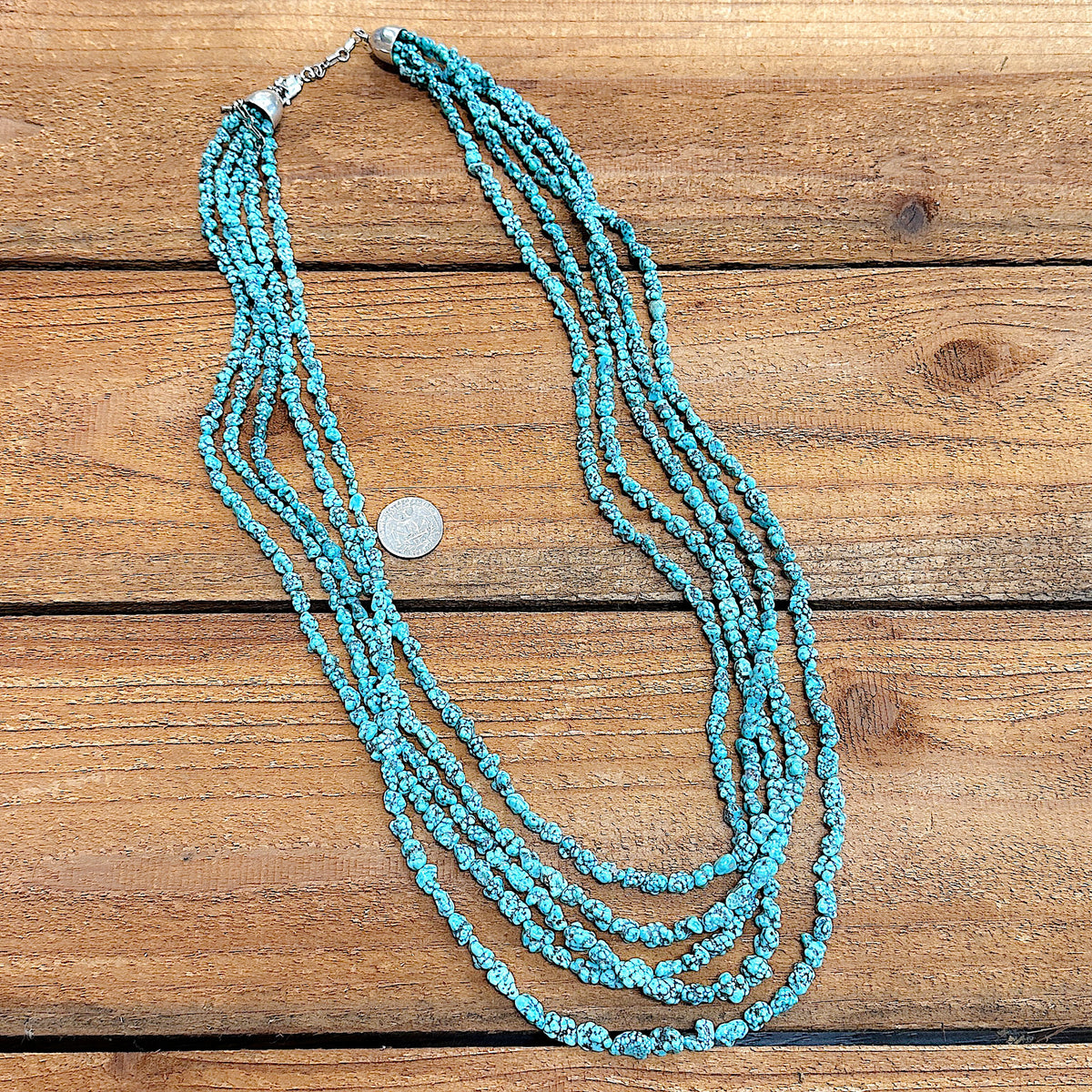 Size comparison of a 36" long Kingman Turquoise necklace that features natural freeform Turquoise nuggets.