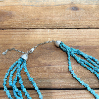 Close up of the clasp of a 36" long Kingman Turquoise necklace that features natural freeform Turquoise nuggets.