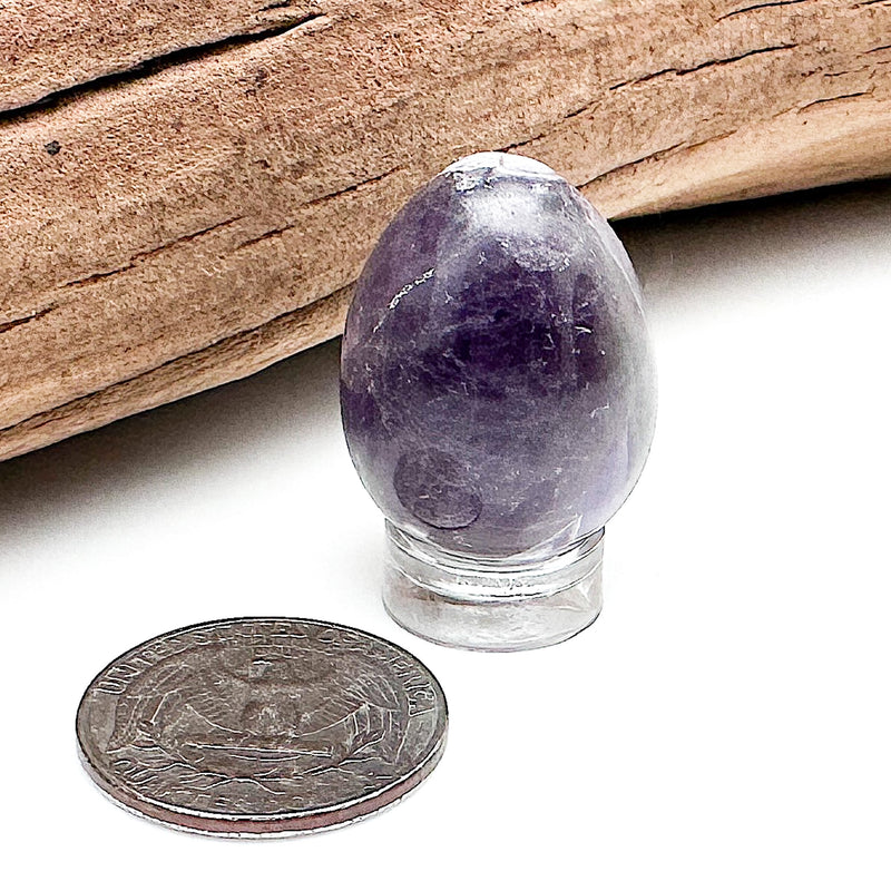 Comparison shot of a US quarter coin and an Amethyst egg