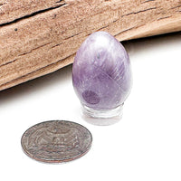 Comparison shot of a US quarter coin and an Amethyst egg