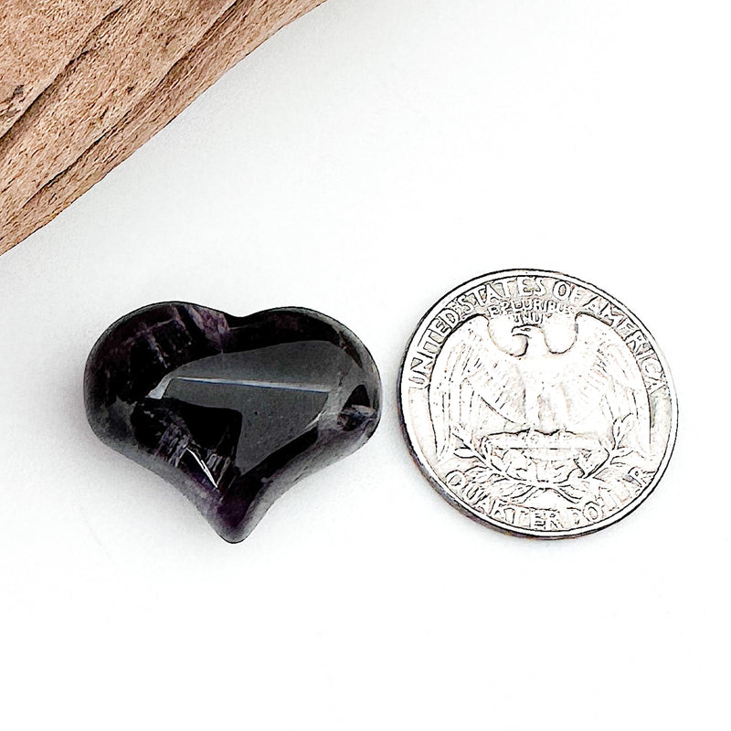 Comparison shot of a US quarter coin and an Amethyst heart