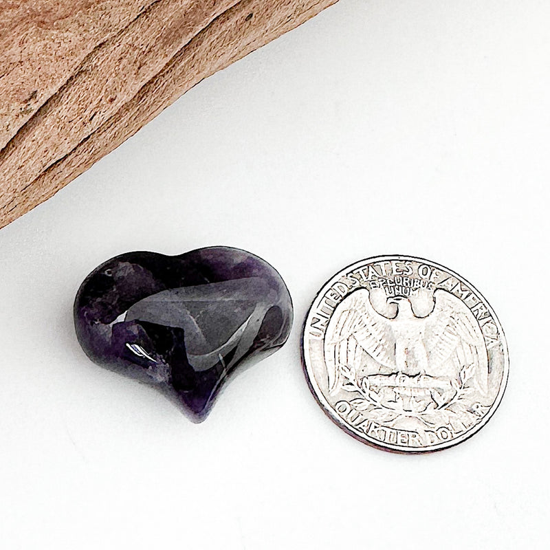 Comparison shot of a US quarter coin and an Amethyst heart