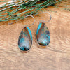 Shot of a pair of boulder turquoise earrings