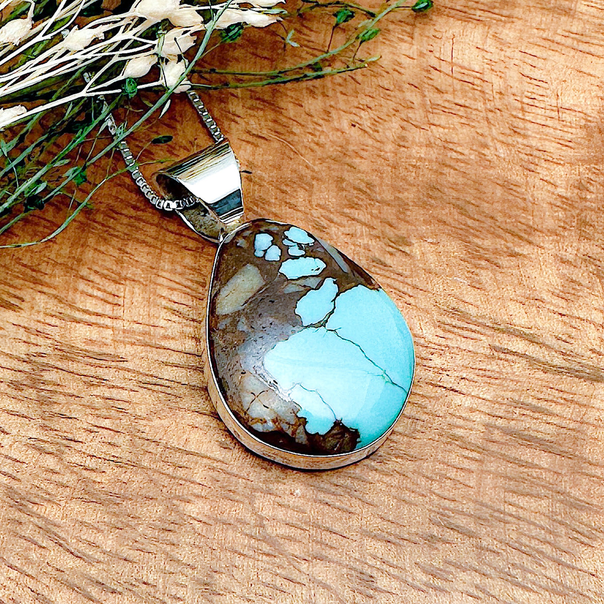 Shot of a boulder turquoise pendant