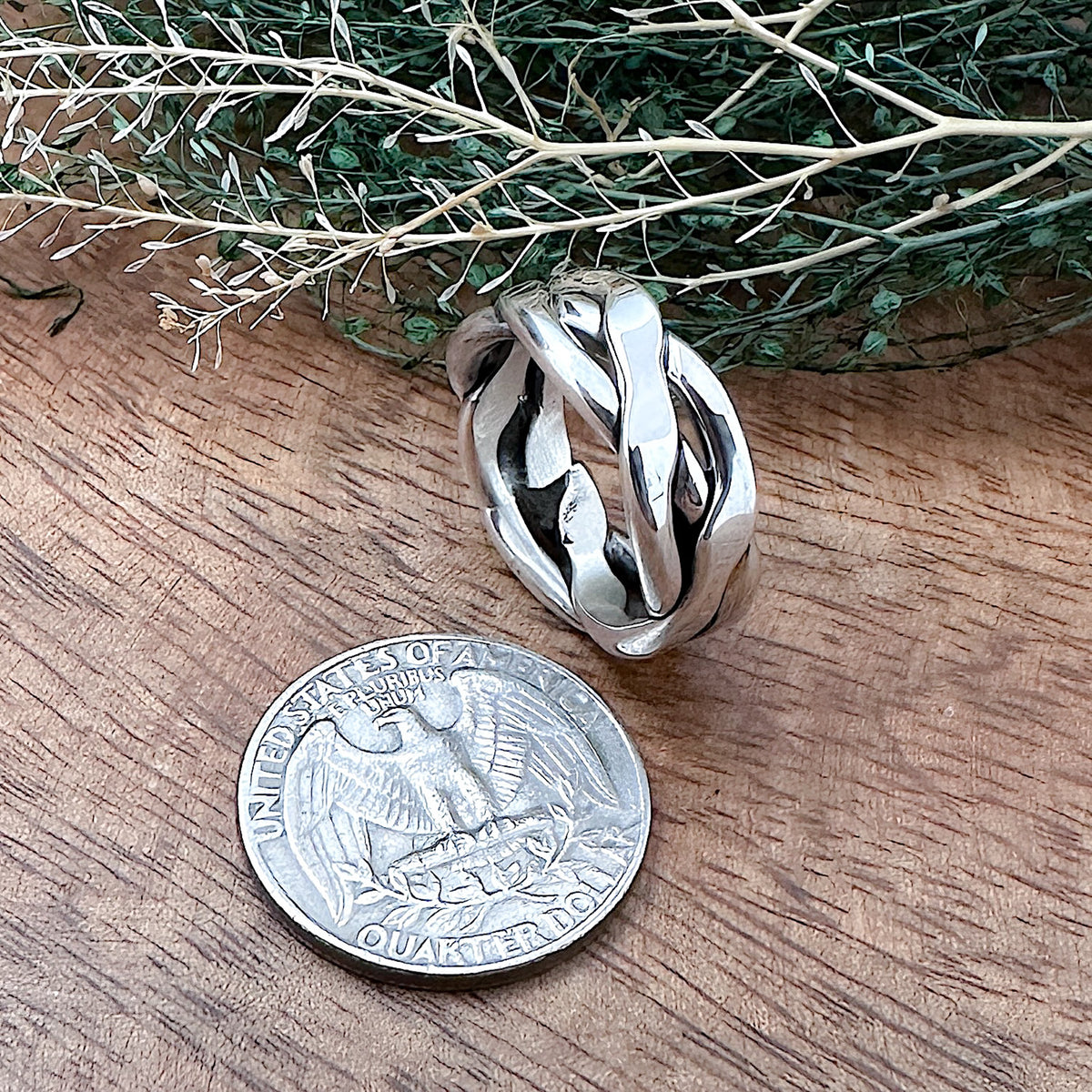 Comparison shot of a US quarter coin and a sterling silver braided ring