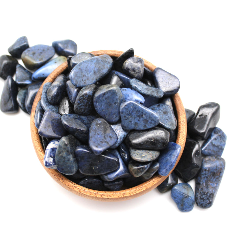 Multiple Dumortierite tumbled stones in a small bowl