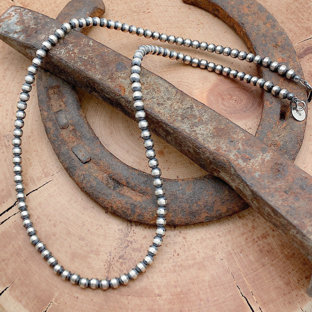 Sterling silver hand crafted necklace that features 3mm beads, an antiqued finish and has a hook and eye clasp.